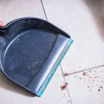 Person sweeping up crumbs. Pest Control Inc, serving Las Vegas NV and Henderson NV talks about how to keep cockroaches out of your home.