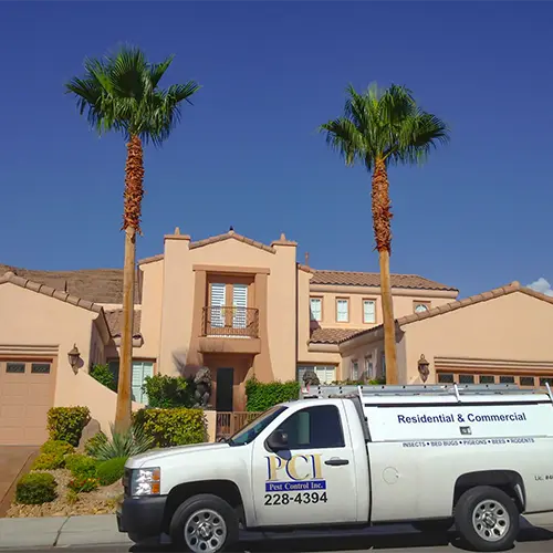 Pest Control Inc Truck providing extermination services at a residential home